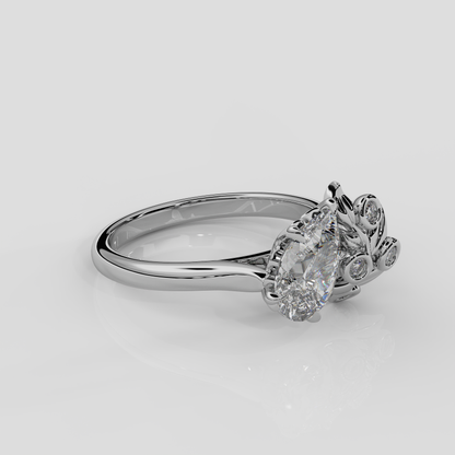 Platinum Berry engagement ring by London jewellery designer, Georgina Yvonne. Nature inspired design with pear diamond centre and diamond accent stones 