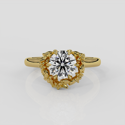 18ct yellow gold halo engagement ring, Blossom by London jewellery designer, Georgina Yvonne. Natured inspired design with round brilliant cut diamond centre 