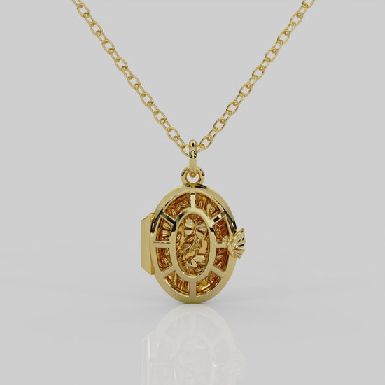 18ct yellow gold Fairytale locket from London jewellery designer, Georgina Yvonne's, award winning Wonderland jewellery collection. With fairytale inspired scene, featuring butterflies, mushrooms, and vines.