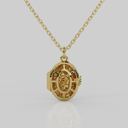 18ct yellow gold Fairytale locket from London jewellery designer, Georgina Yvonne's, award winning Wonderland jewellery collection. With fairytale inspired scene, featuring butterflies, mushrooms, and vines.